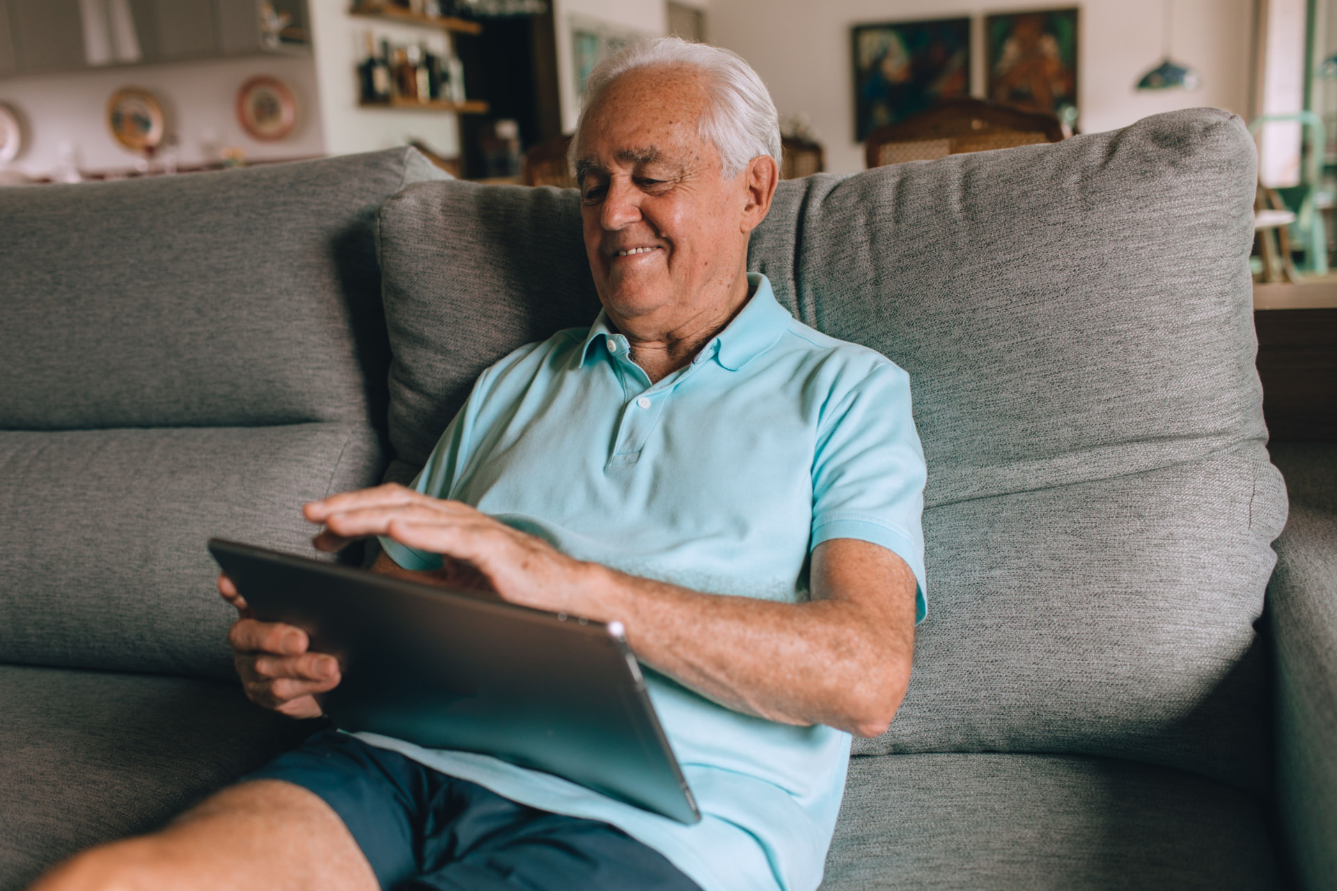 A member following their support program on a tablet at home